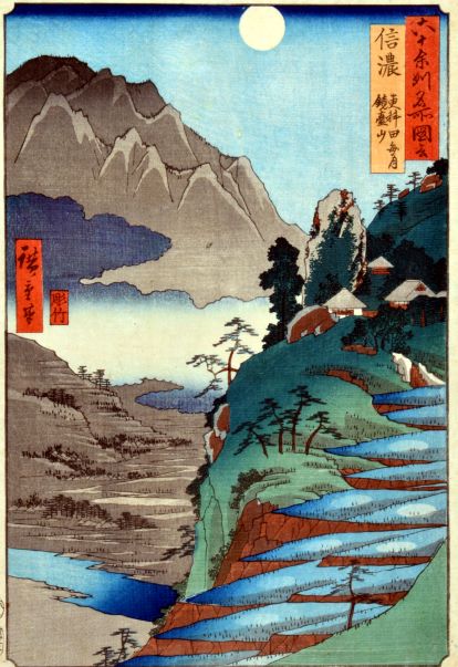 山々が連なり日が昇っている浮世絵の写真